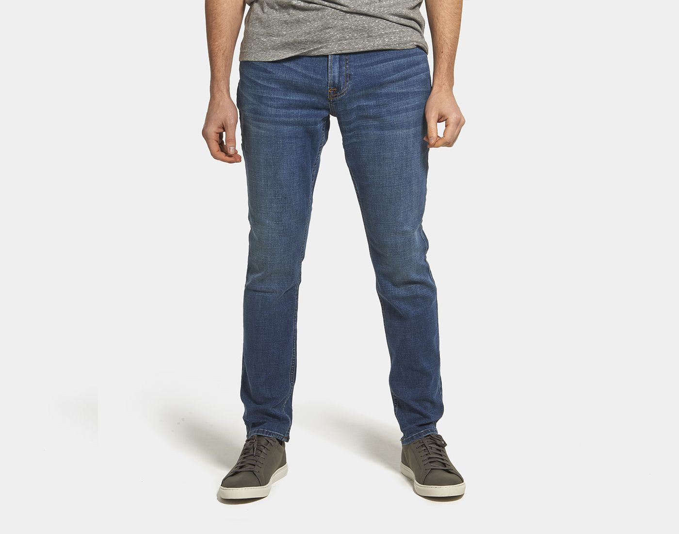 Mid wash denim jeans with custom fit and finish